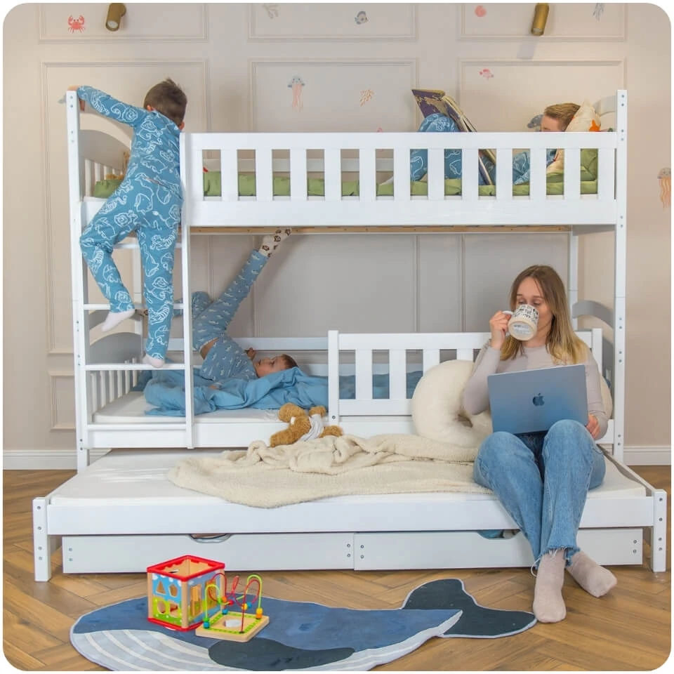 White BLANKA bunk bed with a pull-out lower bed and high safety rails. Children are playing on the bed.